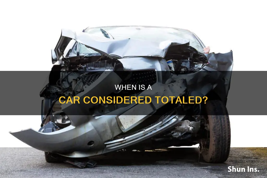 how does insurance decide to total a vehicle